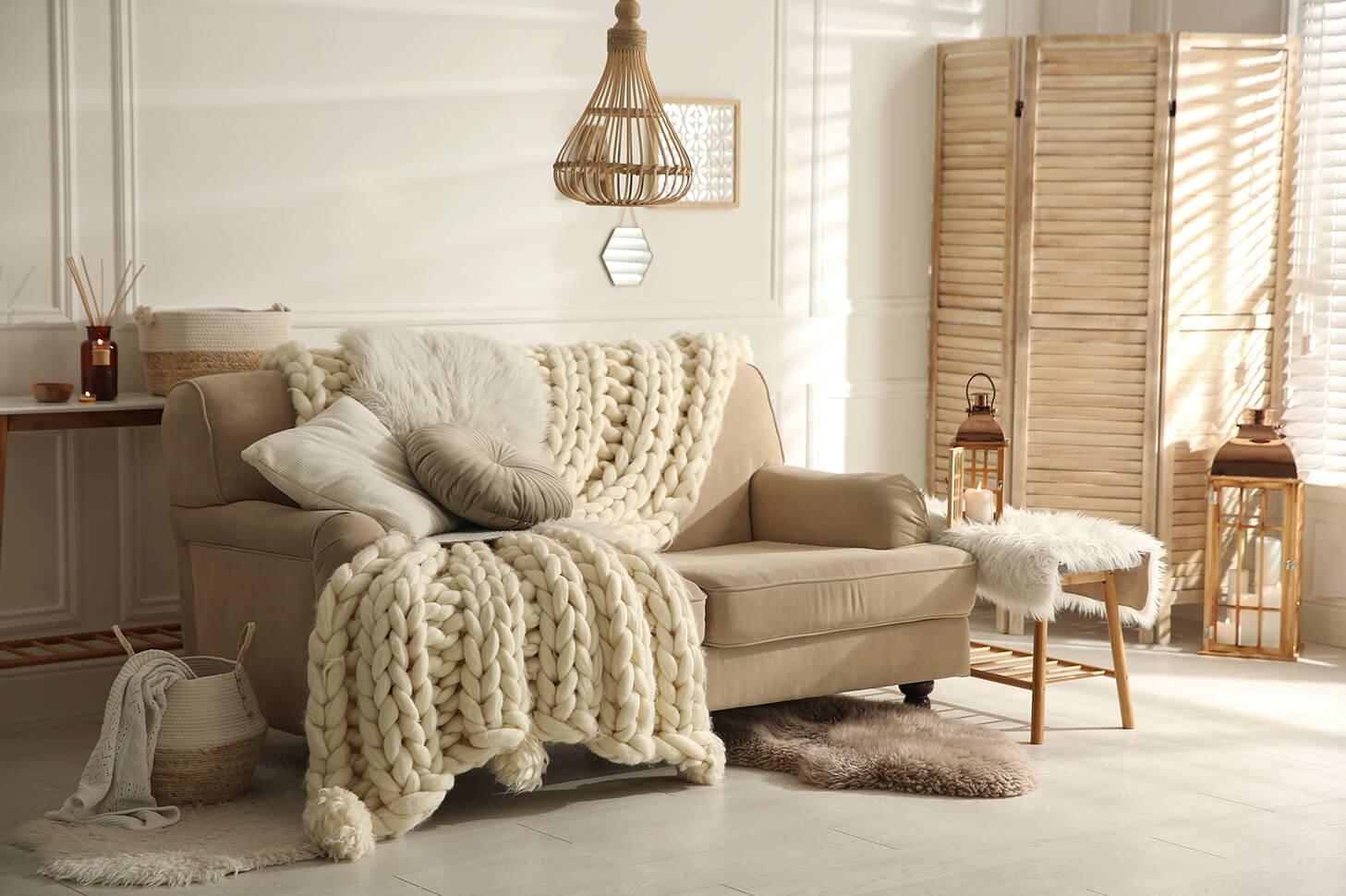 Cozy living room with chunky knit throw.