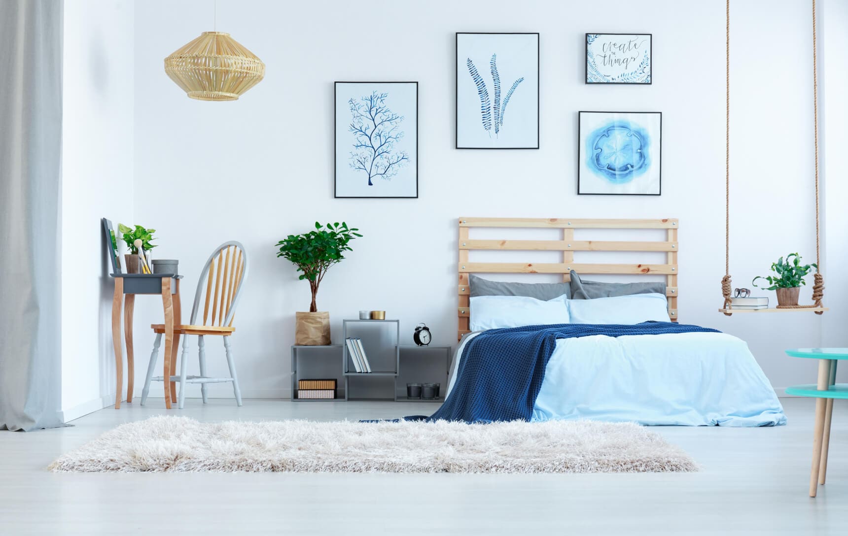 Here's an alt tag for the image: Light blue bedroom with fluffy rug.
