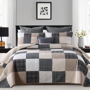 Cozy bedroom with a checkered quilt and neutral-tone pillows.